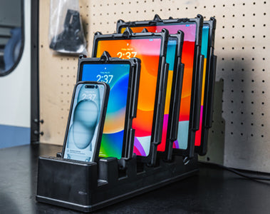 Image of six Apple iPhone and iPads docked in the new GDS Desktop Charging Dock