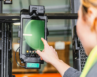 Image of a woman interacting with a Samsung Tab Active5 mounted to a forklift in a GDS Tough-Dock